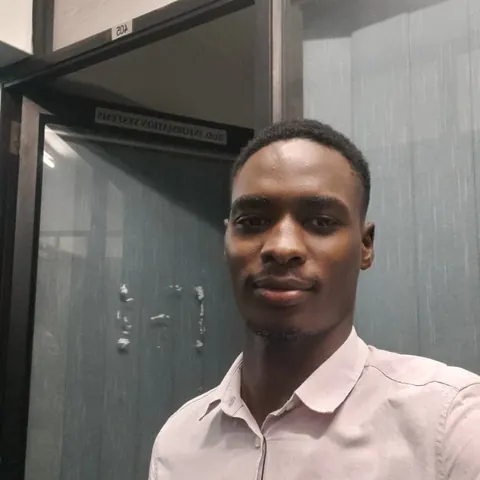 Portrait of Muhumuza Alex